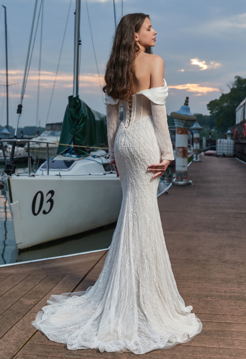 Robe de mariée «Galatée» de chez Herawhite Couture. Cette robe de mariée style sirène est en sequins sur toutes la robe. Disponible en Ivoire et en nude. Cette robe de mariée est disponible dans votre boutique Rêve d'un Jour à Yvetot