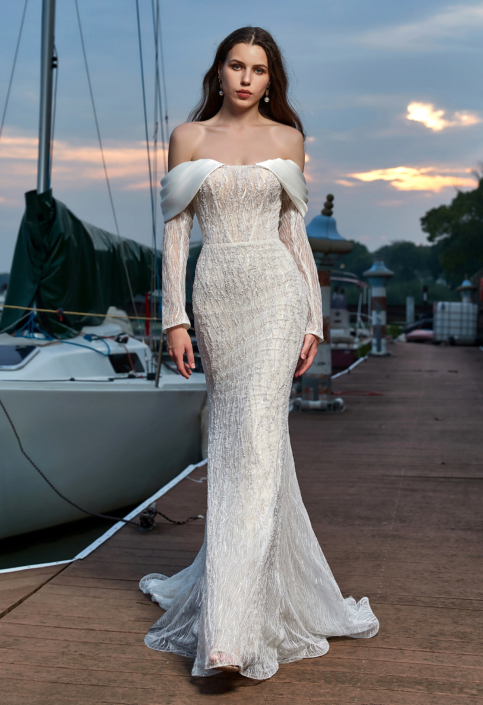 Robe de mariée «Galatée» de chez Herawhite Couture. Cette robe de mariée style sirène est en sequins sur toutes la robe. Disponible en Ivoire et en nude. Cette robe de mariée est disponible dans votre boutique Rêve d'un Jour à Yvetot